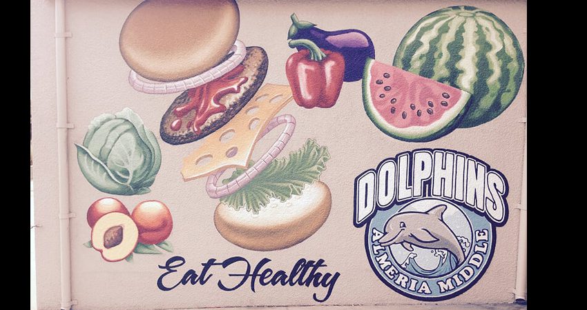 A mural of food with the words " eat healthy dolphin ".