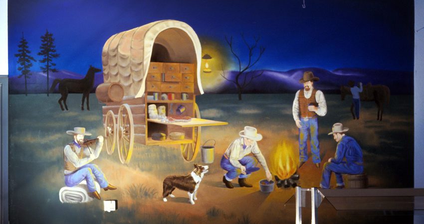 A painting of people and an old wagon.