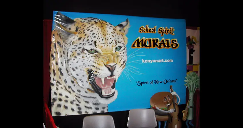 A large sign with an image of a leopard on it.