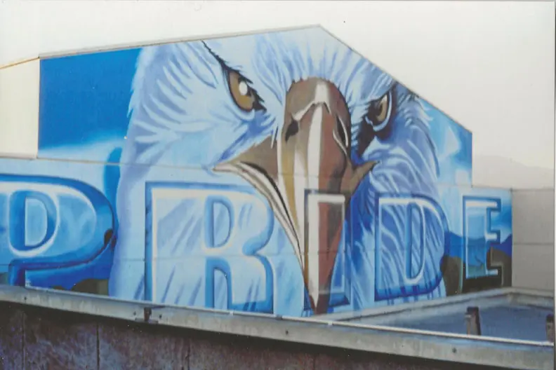 A mural of an eagle on the side of a building.
